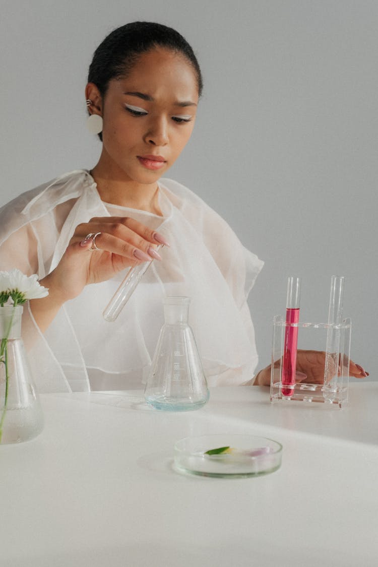 Woman In White Tulle Outfit Pretending Scientist Making Experiment