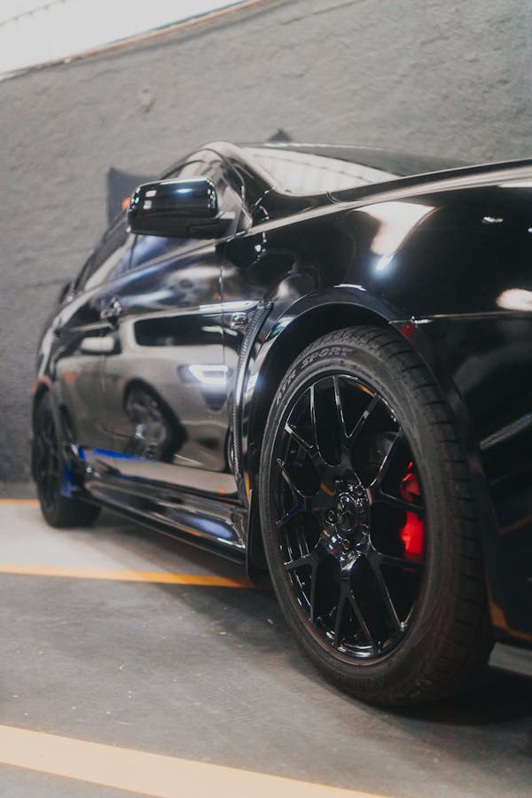 Shiny Black Car Parked on a Garage