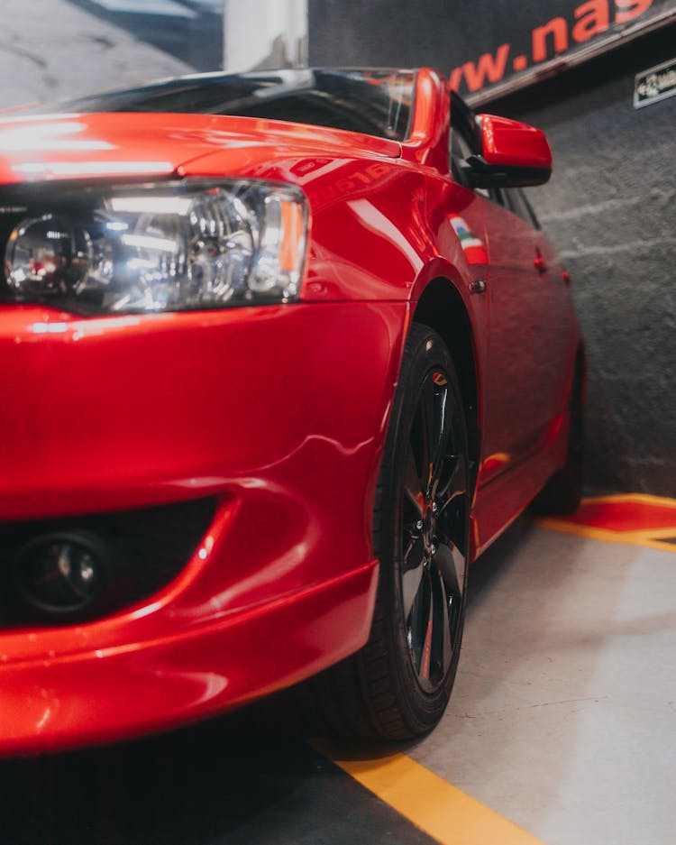 Shiny Red Car In A Garage 