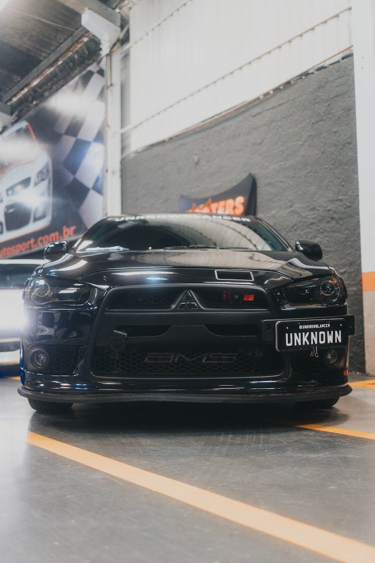 Black Mitsubishi Lancer Parked Inside A Garage