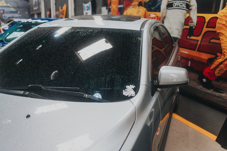 Wet Silver Car Inside A Garage