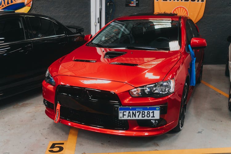 A Red Car Parked In A Garage