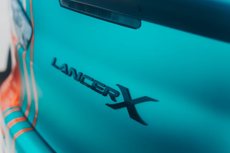 Logo On The Back Of A Mitsubishi Lancer Evolution X