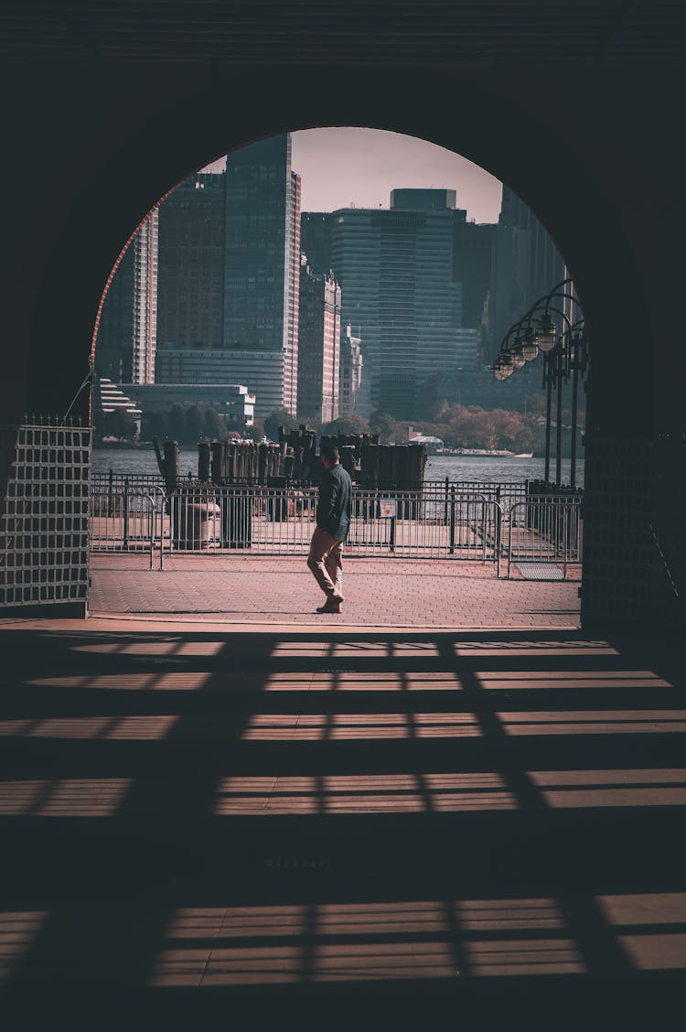 Tunnel In City And Sea And Buildings Behind