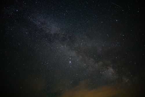 Free A breathtaking view of the starry night sky showcasing the Milky Way and countless stars. Stock Photo