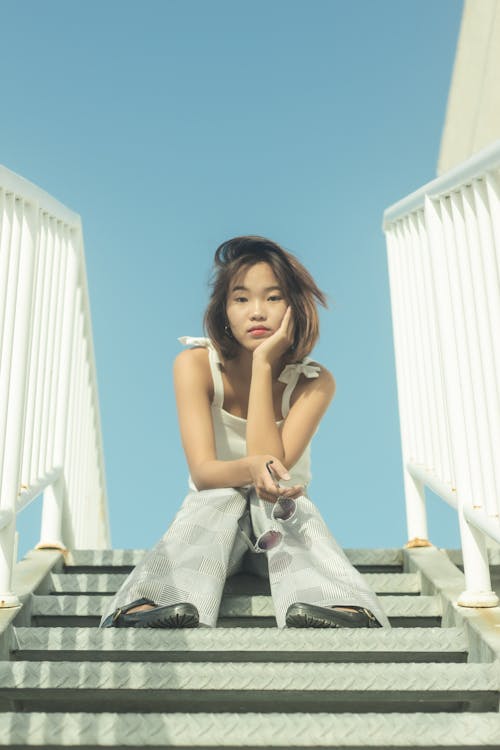 Portrait of a Woman Sitting on the Steps