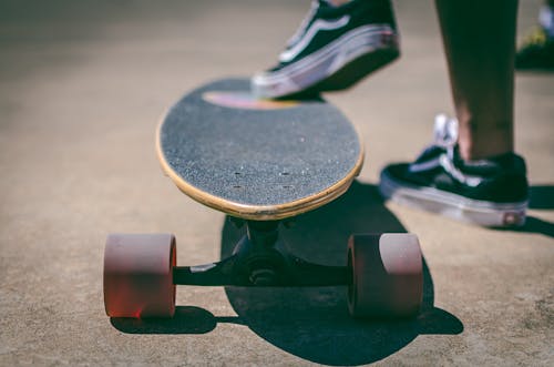 Free Shallow Focus Photography of Longboard Stock Photo