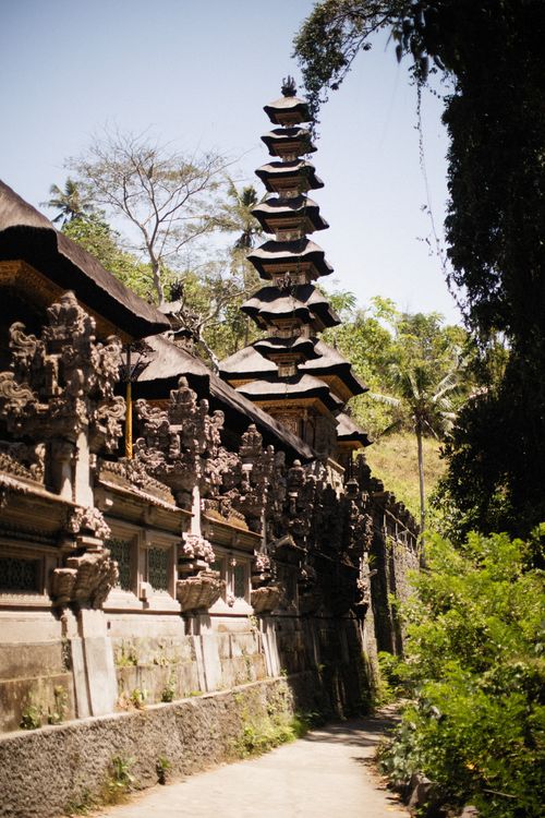 Free Explore the intricate details and lush surroundings of an ancient eastern temple, perfect for travel photography. Stock Photo