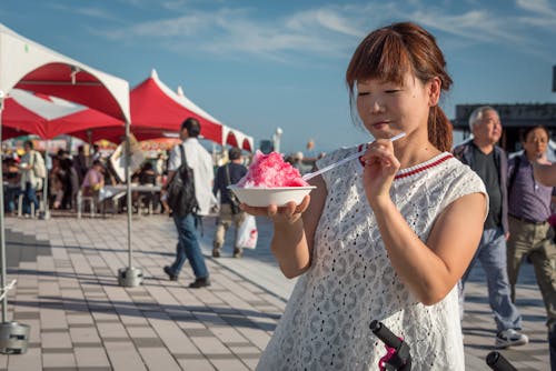 Photo of Woman Holding Bowl With Dessert