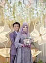 Newlywed Couple Looking at the Camera