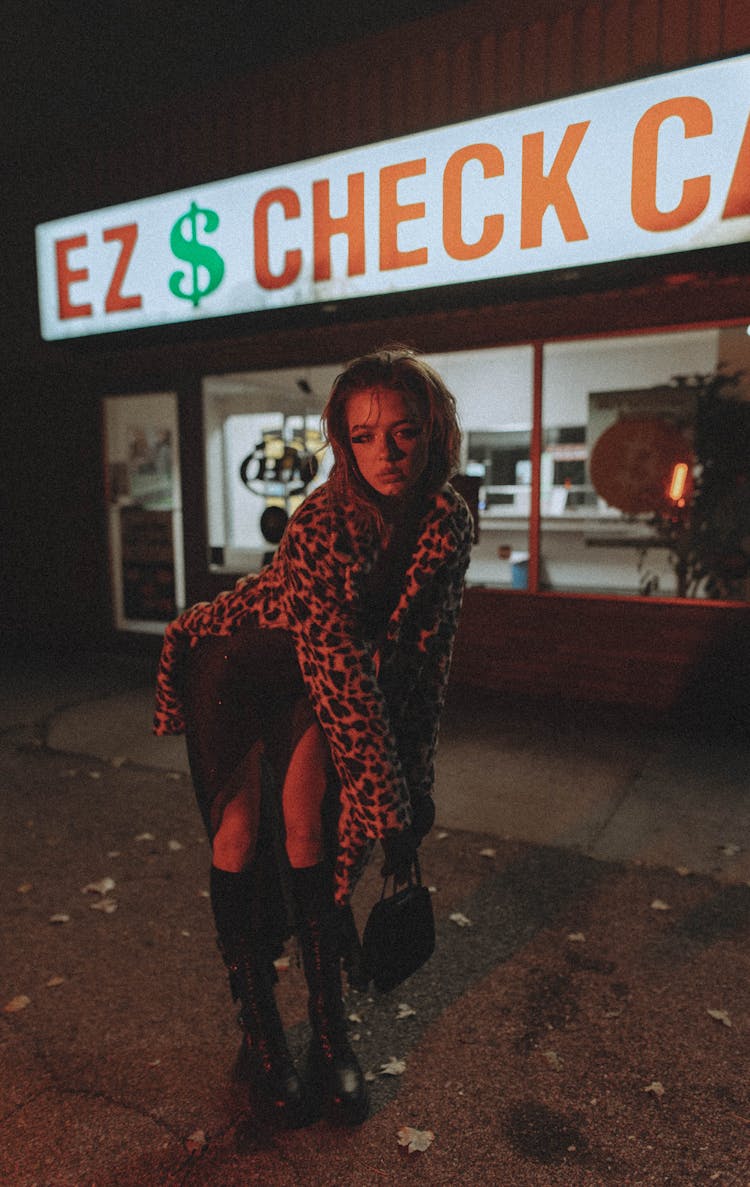 Woman In Leopard Print Coat Posing