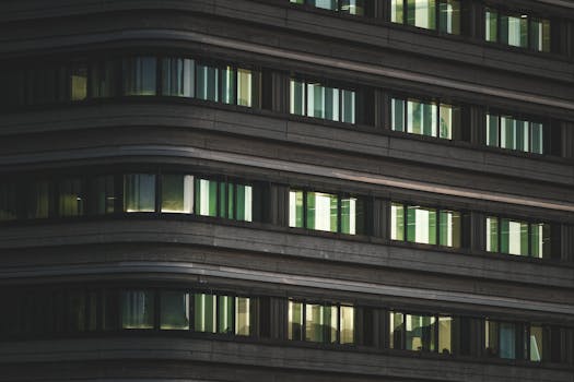 Close-up view of a modern office building exterior with horizontal windows.