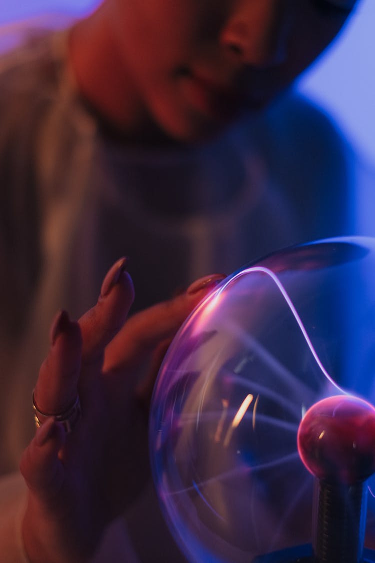 A Close Up On Female Touching Plasma Ball 