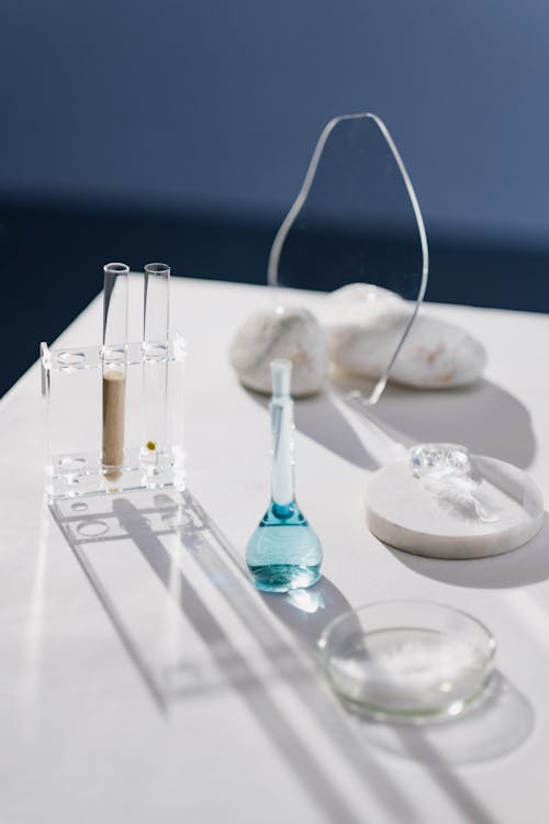Free Flask with Liquid and Test Tubes on Table Stock Photo