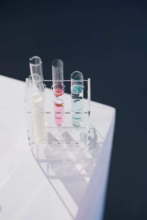 Free Colorful liquids in test tubes under sunlight, representing a vibrant science experiment. Stock Photo
