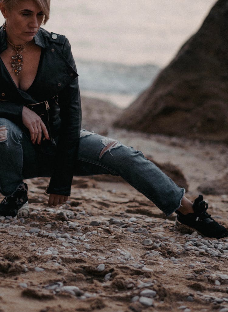 Woman In Leather Jacket Crouching