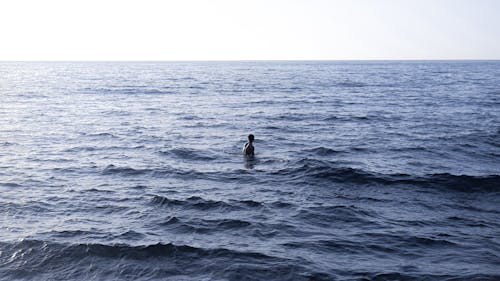 Man Standing in Ocean Water