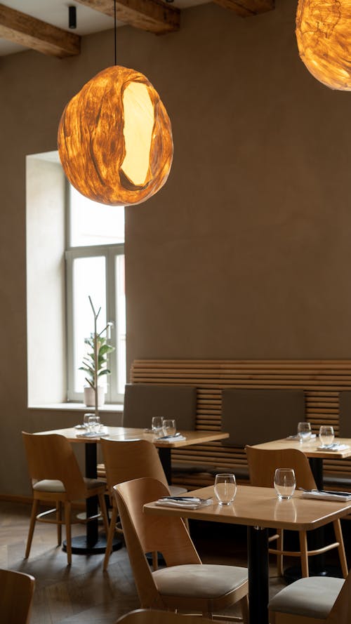 Brown Tables with Chairs in the Coffee Shop