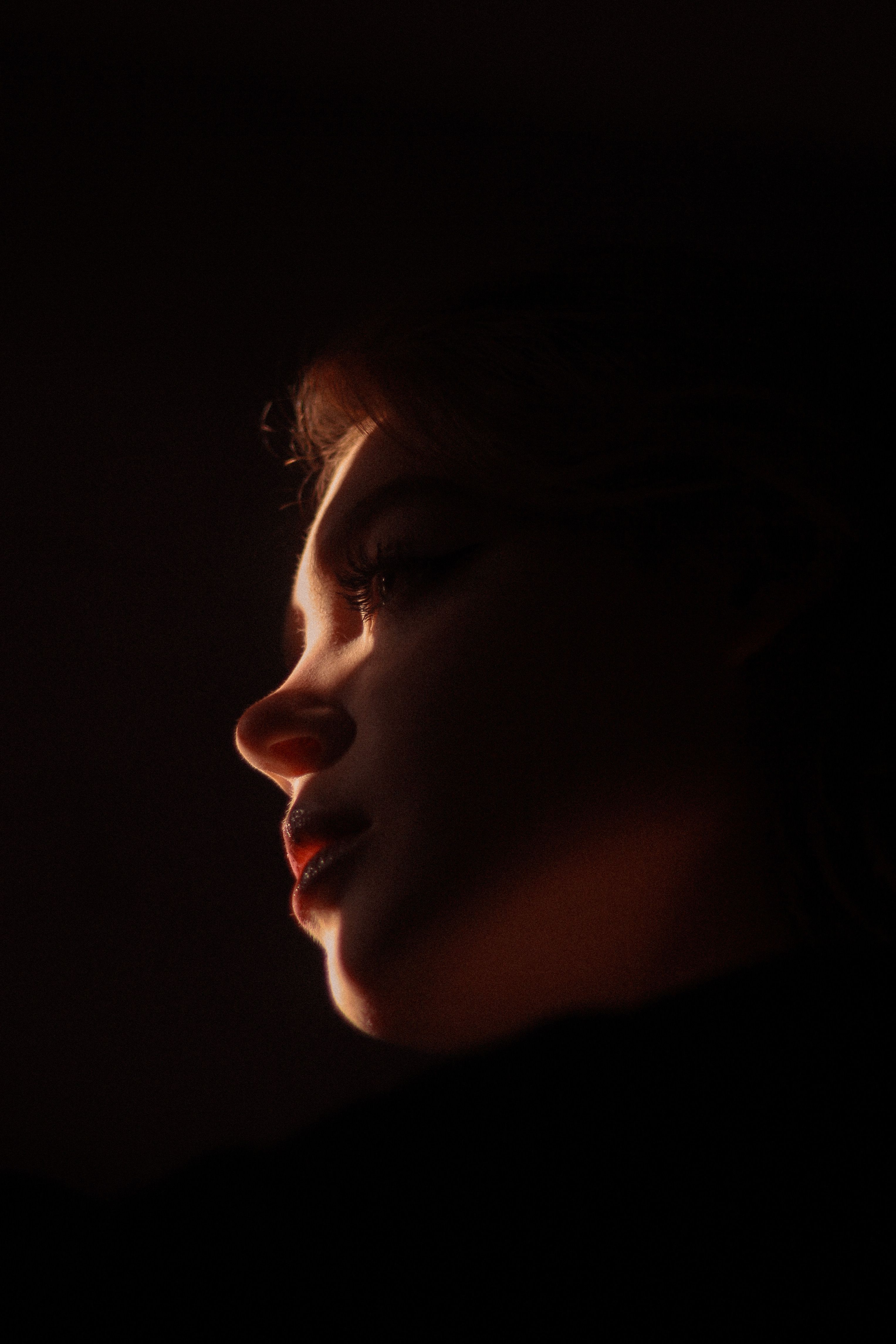 Womans Face in Darkness · Free Stock Photo
