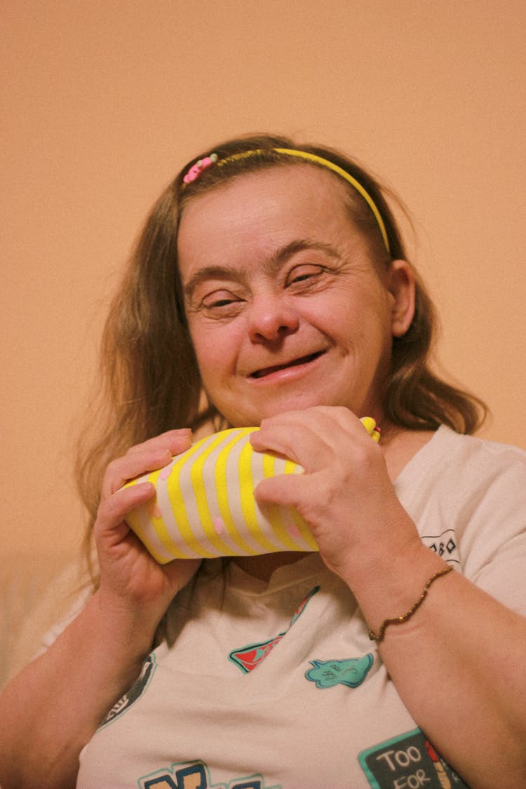 Portrait Of Happy Woman Holding Gift