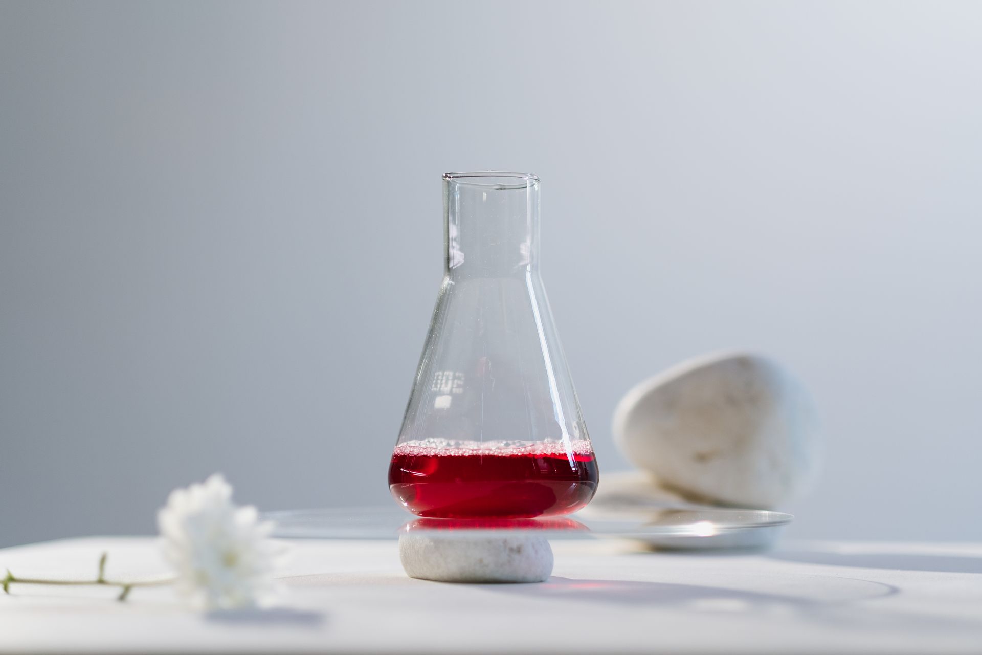 A Shot of Chemistry Flask With a Liquid in It