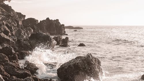 A Wave Crashing on a Rocky Coast