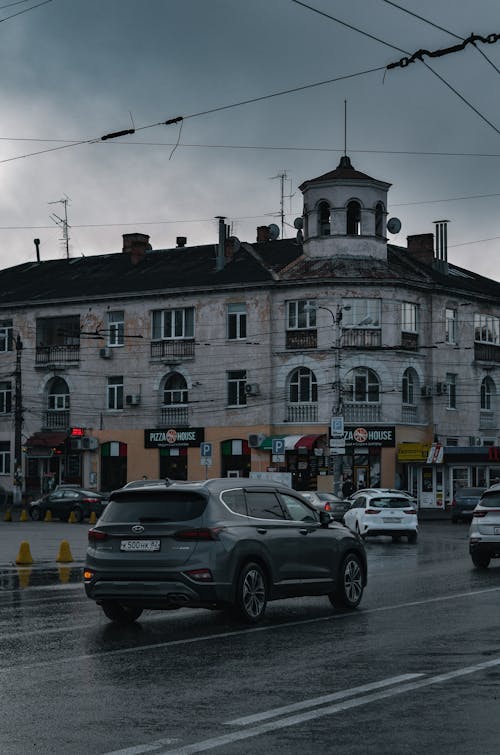 Vehicles on Street Under a Gloomy Sky