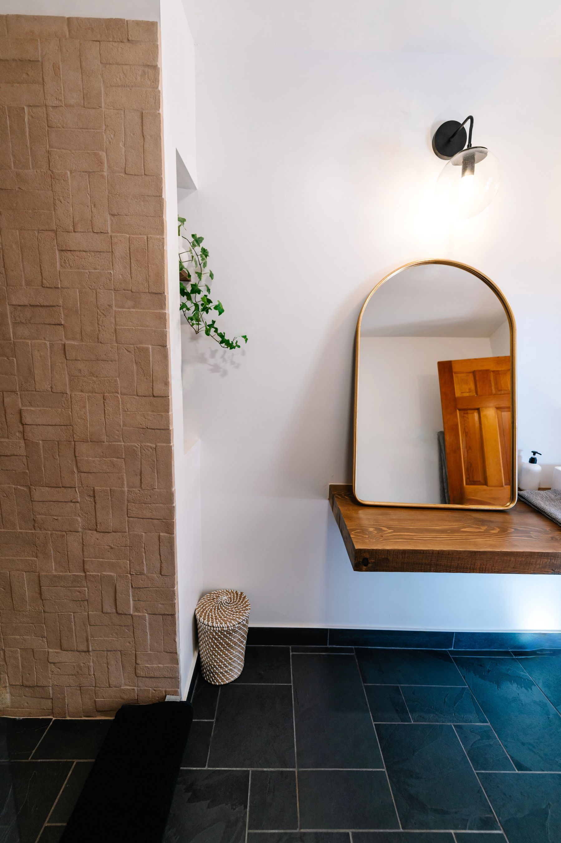 Calm bathroom vanity with mirror, basin and balanced lighting