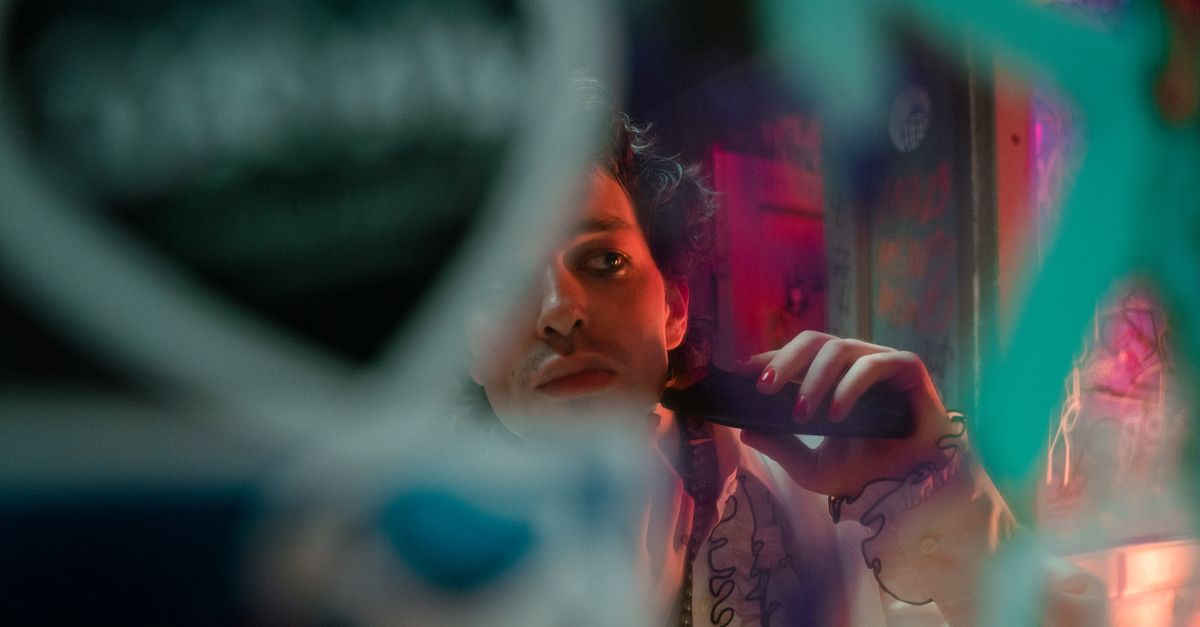 Prince performing in the 1980s with a telephone prop on stage