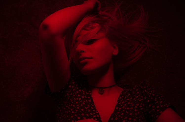 Blonde Woman In Red Light