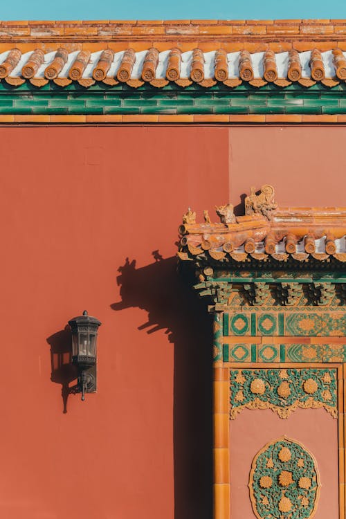 Free Black Lantern on Red Wall of Traditional Chinese Building Stock Photo