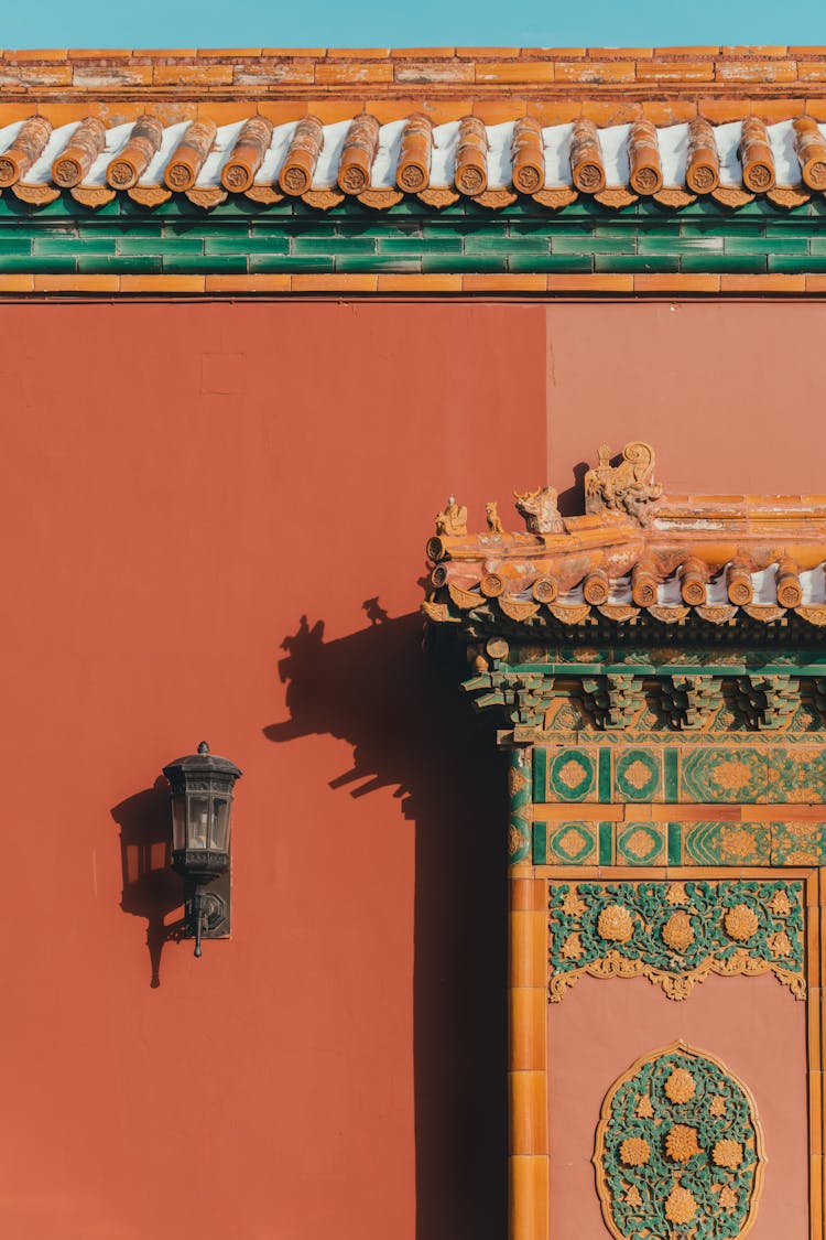 Black Lantern On Red Wall Of Traditional Chinese Building