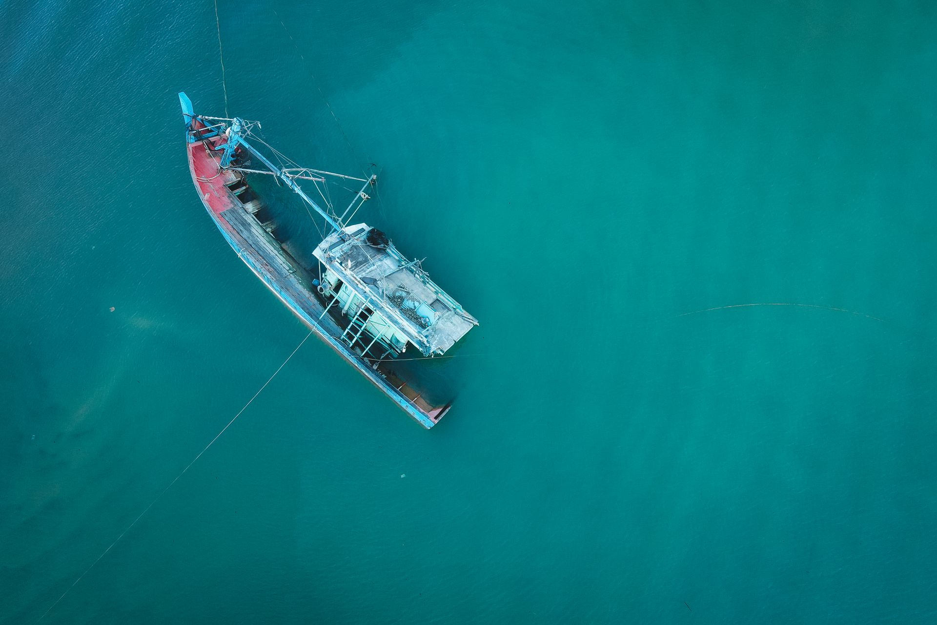 Aerial photograph of a sunken shipwreck in turquoise water near Chukai, Terengganu, Malaysia.