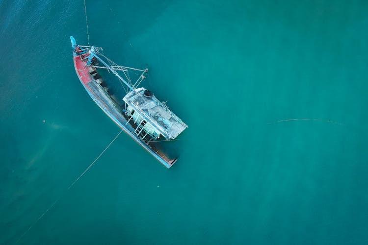 Sunken Boat On Blue Sea