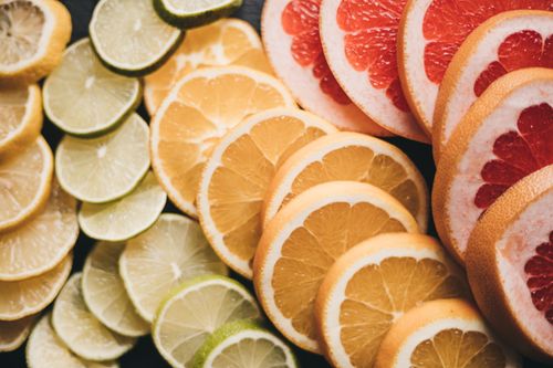 Free Close-up of various sliced citrus fruits showcasing vibrant colors and textures. Stock Photo