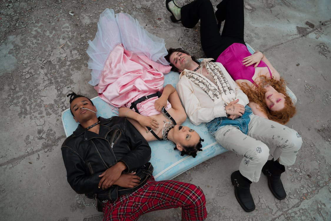 Group of People Lying on Blue Mattress · Free Stock Photo