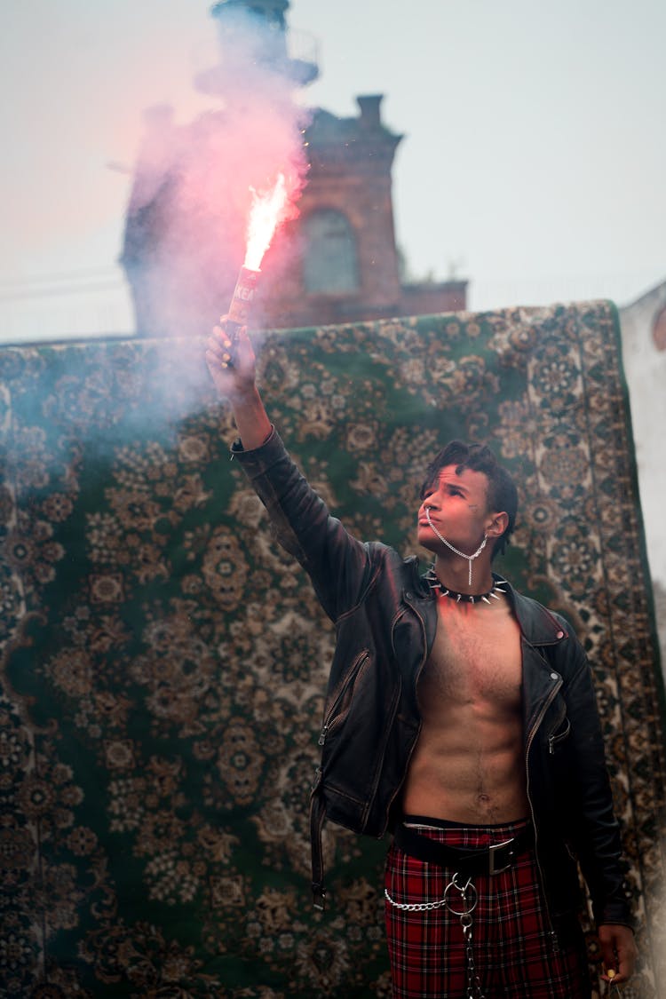 A Man Holding A Flare