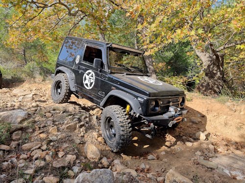 A Black Jeep Wrangler on a Rocky Dirt Road