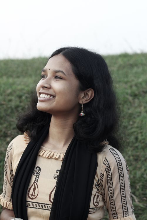 Free A joyful South Asian woman with traditional attire smiles warmly outdoors in Bangladesh. Stock Photo