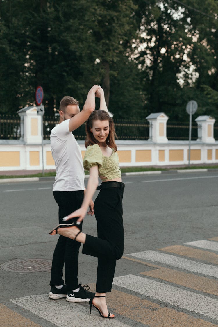 A Couple Dancing On The Street