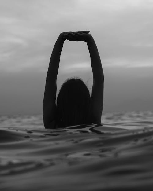 Free Grayscale Photo of Woman in Water Stock Photo