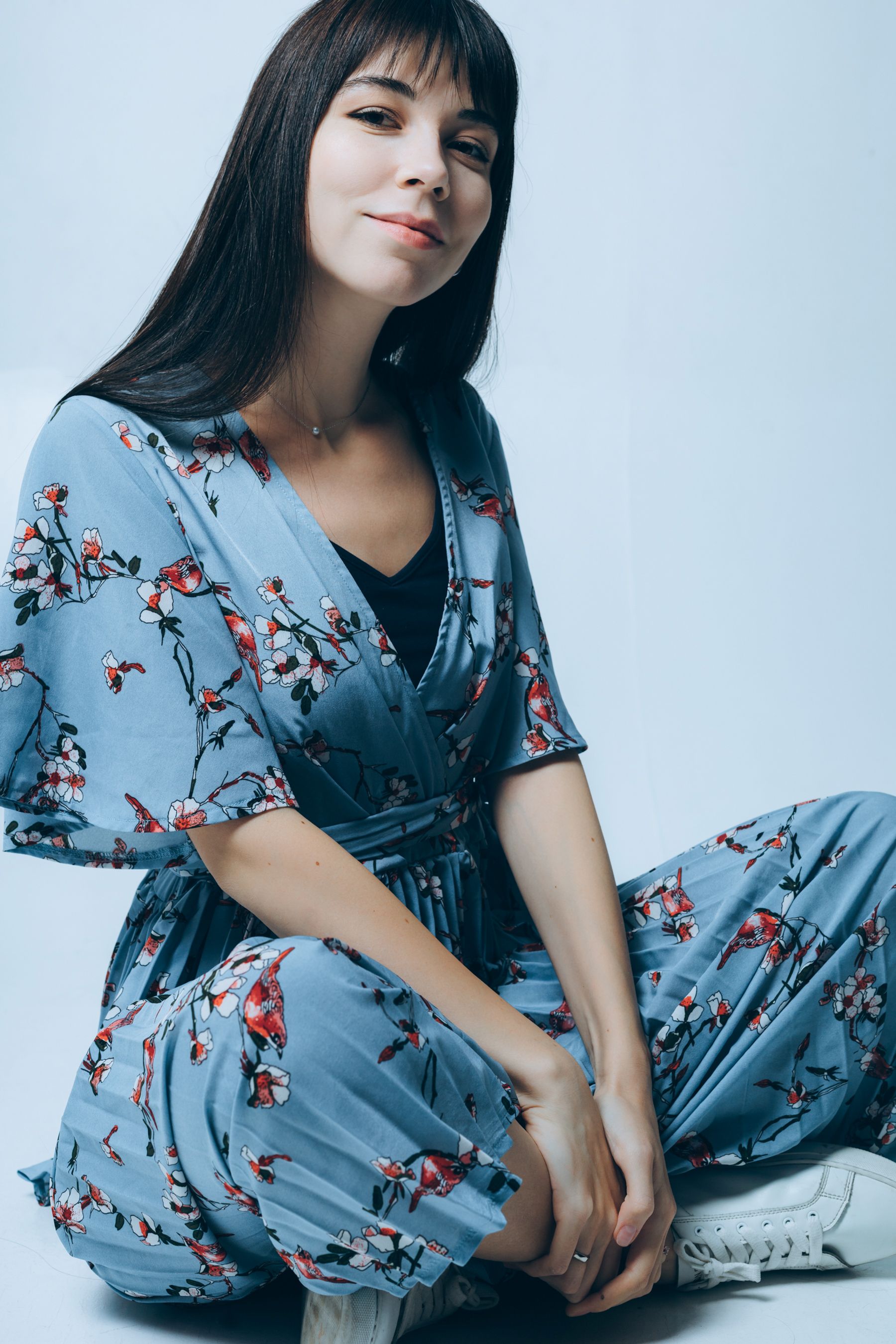 A Woman in Blue Floral Dress Sitting on the Floor · Free Stock Photo