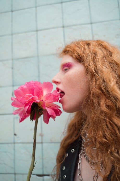 Woman Licking a Pink Flower 