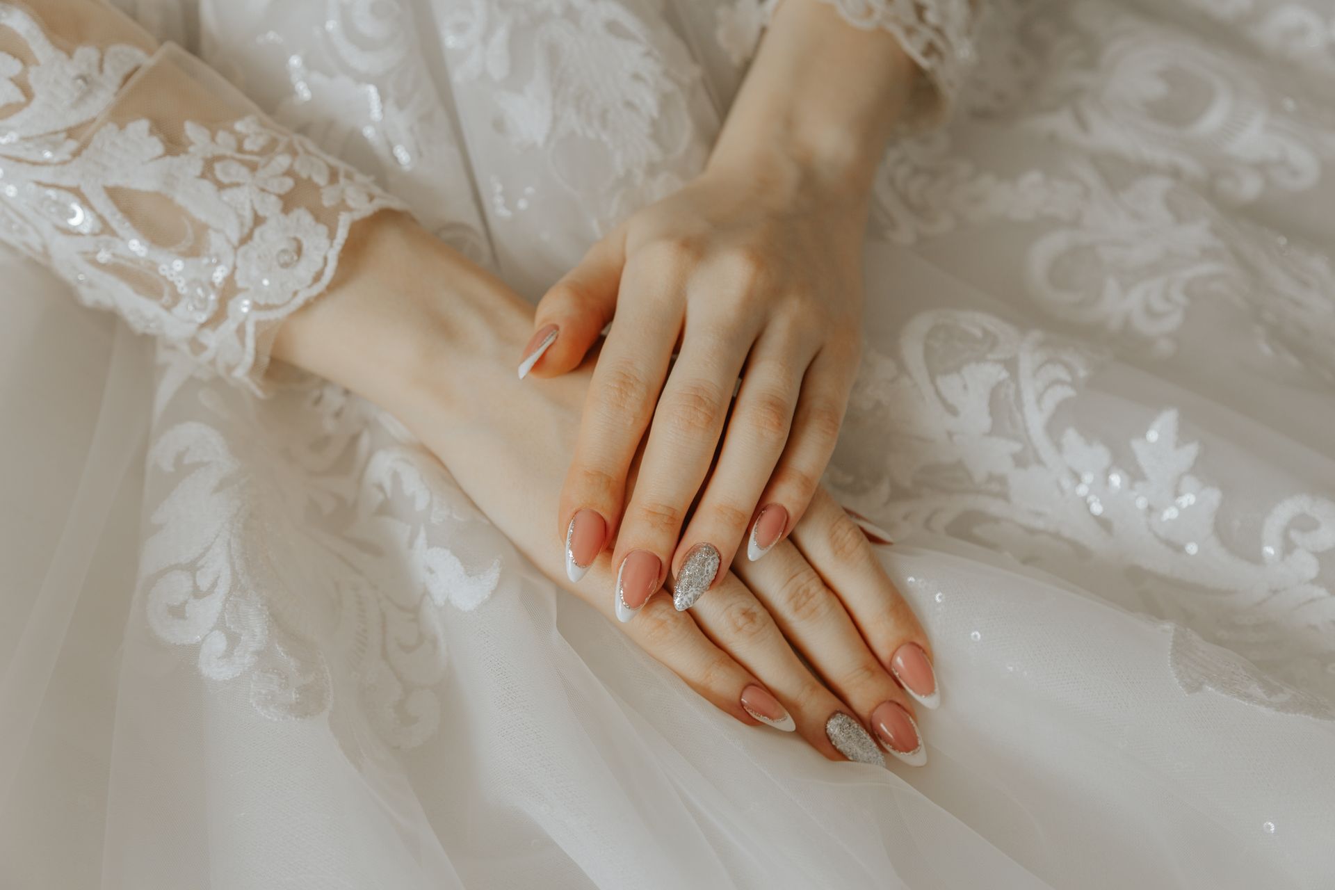 Hands of Bride in Wedding Dress