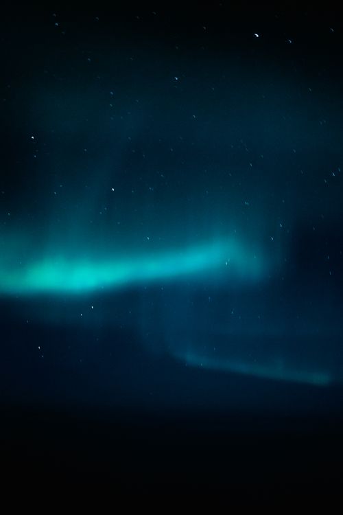 Free Stunning aurora borealis display under a starry night sky, showcasing vibrant colors. Stock Photo