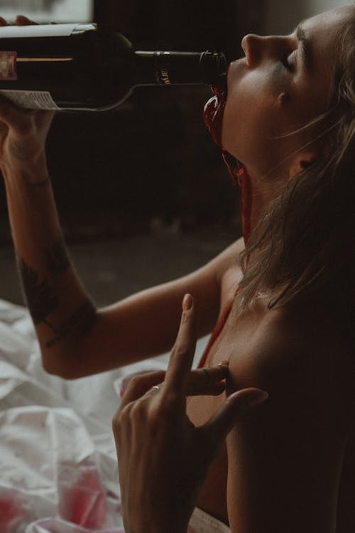 Close Up Photo of Woman Drinking Wine