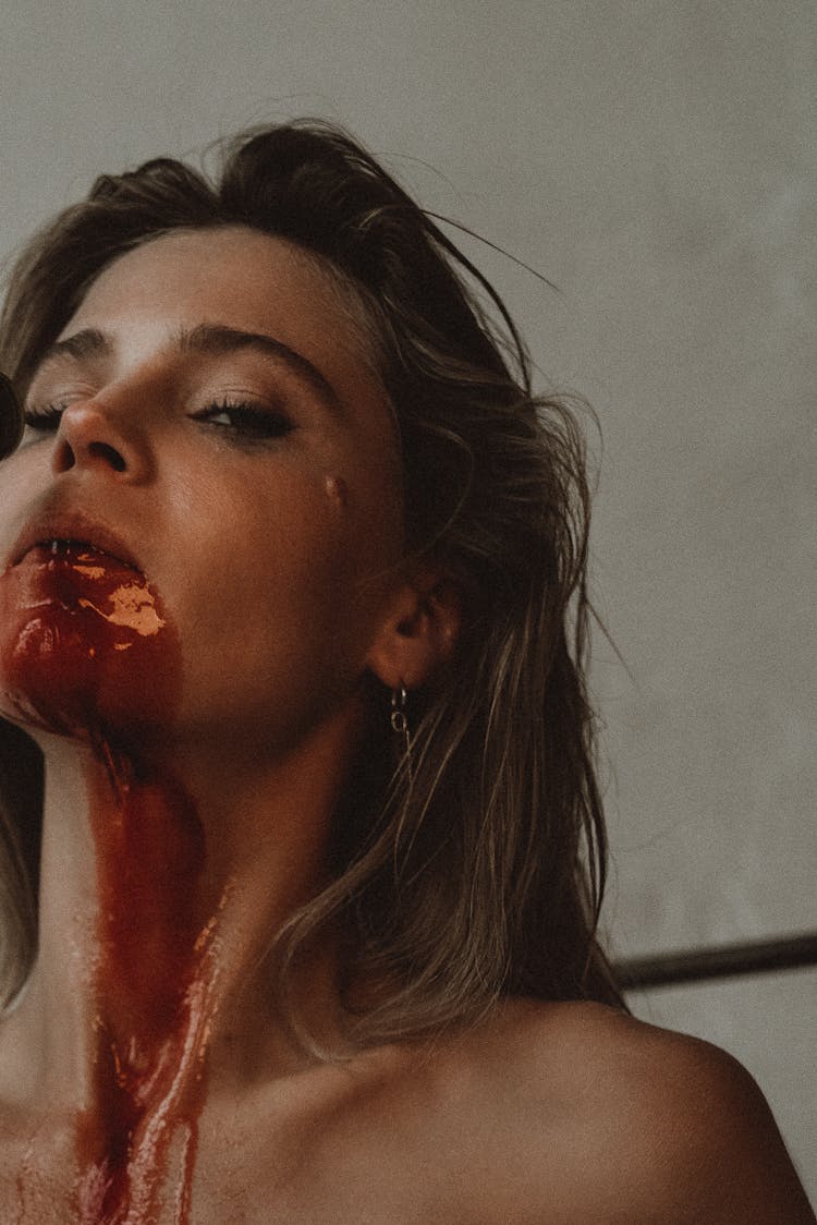 Woman With Blood On Face