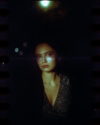 Portrait lit by night-time window light, photo by Nurlan Tortbayev on Pexels