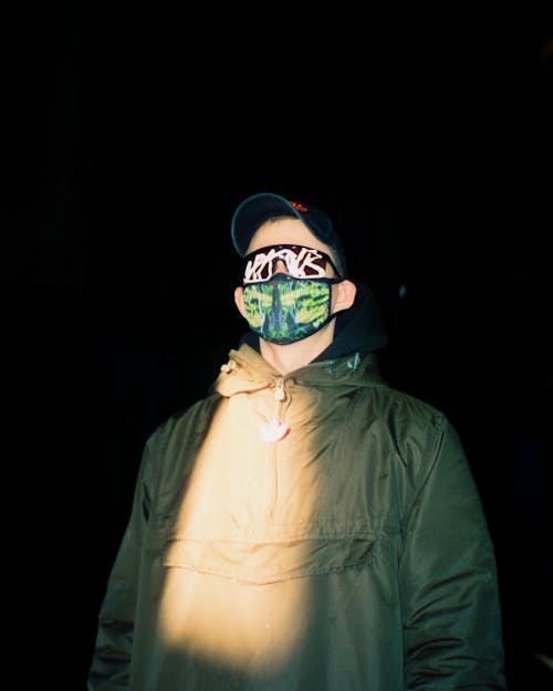 Free A Low Angle Shot of a Man Wearing Face Mask and Sunglasses Stock Photo