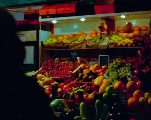 Free Colorful display of fresh fruits at a bustling Moscow marketplace. Ideal for food and travel themes. Stock Photo